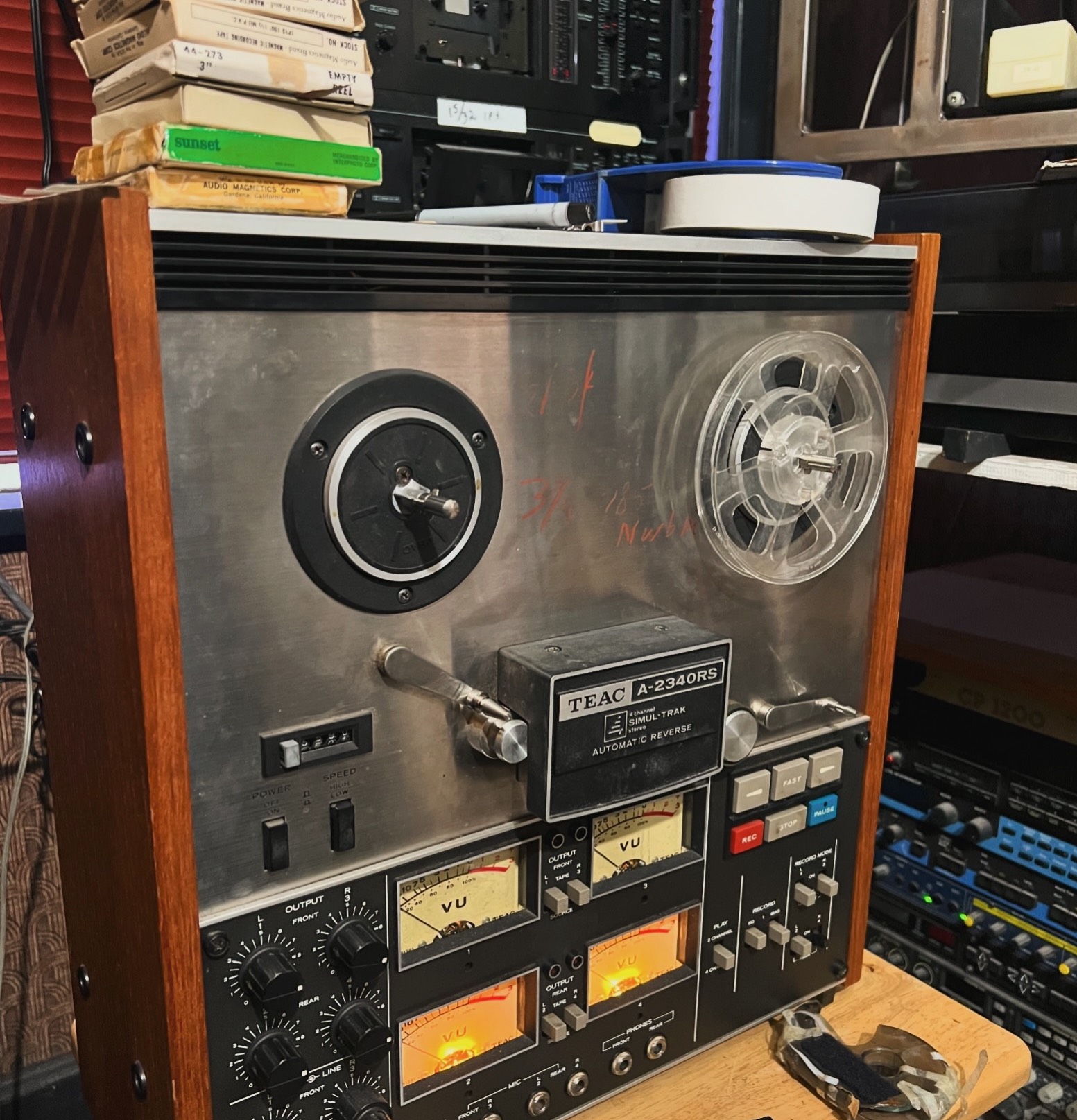 Reel-to-reel audio tapes being converted to digital on TEAC deck at the studio